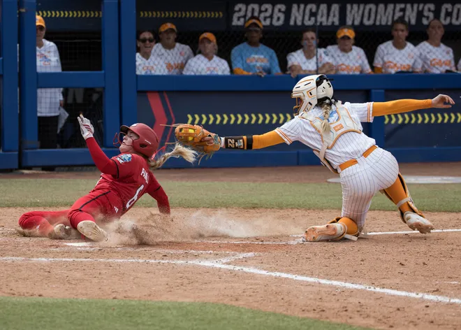 May 30, 2026; Oklahoma City, OK, USA; Texas Tech Red Raiders third baseman Taylor Pannell (6) slides safe past the tag by Tennessee Lady Volunteers catcher Elsa Morrison (22) in the seventh inning during the NCAA Women's College World Series at Devon Park.