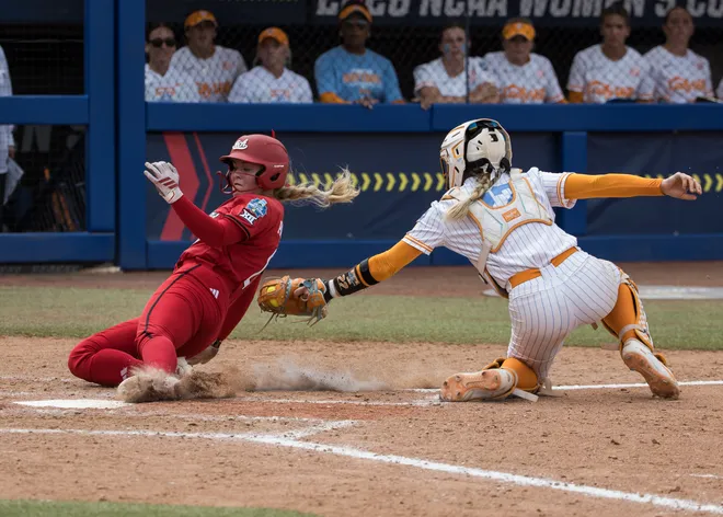 May 30, 2026; Oklahoma City, OK, USA; Texas Tech Red Raiders third baseman Taylor Pannell (6) slides safe past the tag by Tennessee Lady Volunteers catcher Elsa Morrison (22) in the seventh inning during the NCAA Women's College World Series at Devon Park.