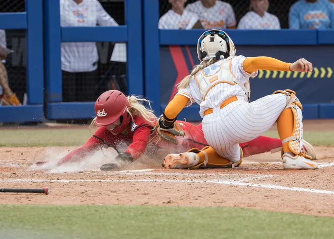May 30, 2026; Oklahoma City, OK, USA; Texas Tech Red Raiders second baseman Mia Williams (1) is tagged out by Tennessee Lady Volunteers catcher Elsa Morrison (22) in the sixth inning during the NCAA WomenÕs College World Series at Devon Park.