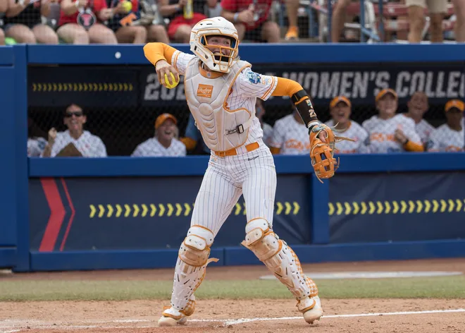 May 30, 2026; Oklahoma City, OK; Tennessee Lady Volunteers catcher Elsa Morrison (22) celebrates after tagging Texas Tech Red Raiders second baseman Mia Williams (not pictured) out at home in the sixth inning during the NCAA Women's College World Series at Devon Park.