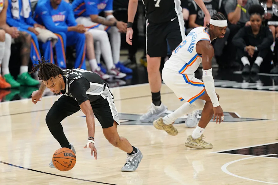 May 28, 2026; San Antonio, Texas, USA; San Antonio Spurs guard Stephon Castle (5) steals the ball from Oklahoma City Thunder guard Shai Gilgeous-Alexander (2) in the second half during game six of the western conference finals for the 2026 NBA playoffs at Frost Bank Center. Mandatory Credit: Dustin Safranek-Imagn Images