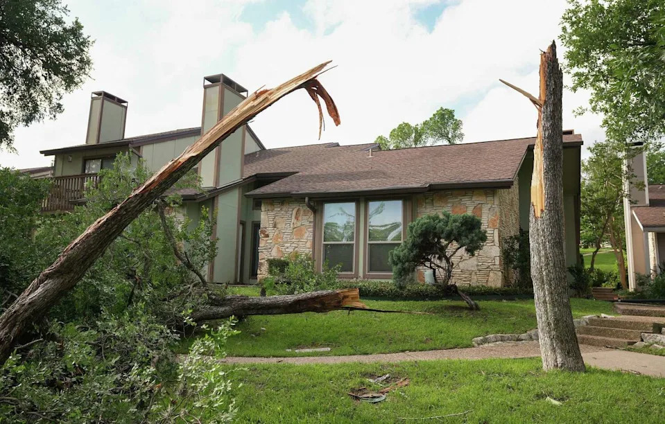 A snapped tree is seen at the Timber Ridge townhomes on Royal Hill Drive in Austin on Monday, May 11, 2026, after a storm moved through the area Sunday night. (Jay Janner/Austin American-Statesman)