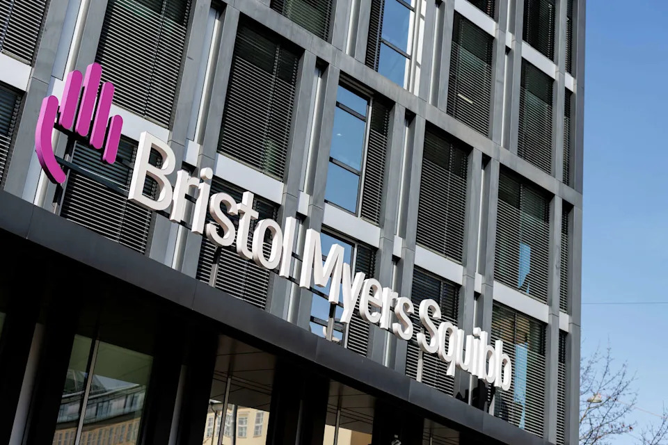 The logo of the pharmaceutical company Bristol-Myers Squibb, (BMS) is seen on the facade of the company's Munich headquarters on March 10, 2026 in Munich (Bavaria, Germany). The company is considering Houston for a $1-billion manufacturing campus. (picture alliance/dpa/picture alliance via Getty I)