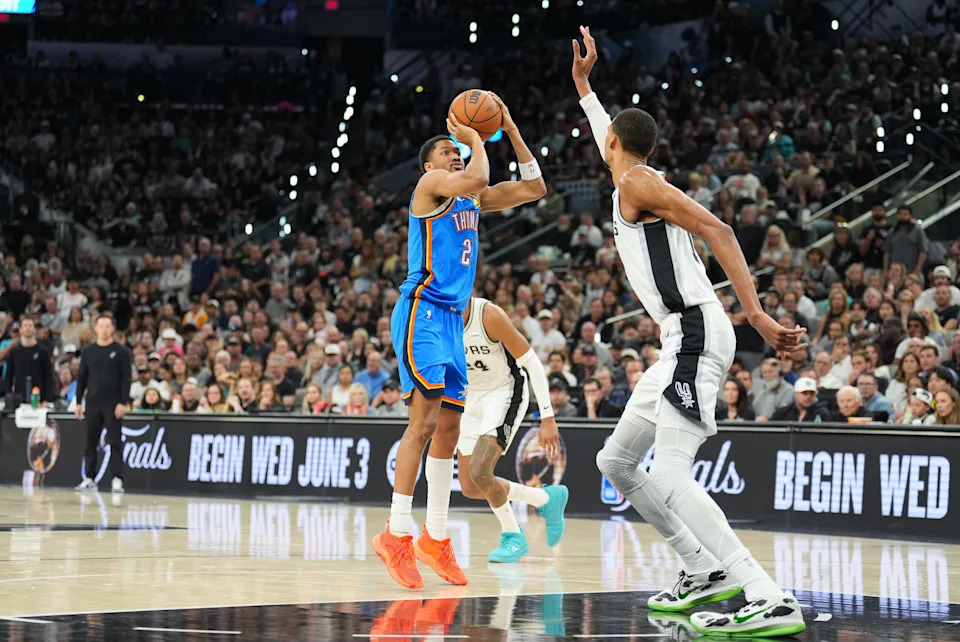 May 24, 2026; San Antonio, Texas, USA; Oklahoma City Thunder guard Shai Gilgeous-Alexander (2) shoots while defended by San Antonio Spurs center Victor Wembanyama (1) in the fourth quarter during game four of the western conference finals for the 2026 NBA playoffs at Frost Bank Center. Mandatory Credit: Daniel Dunn-Imagn Images