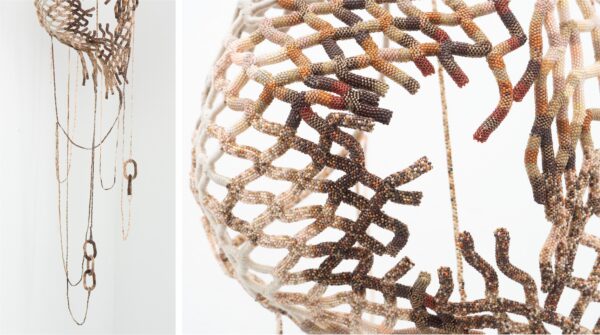 A complex artwork of intricate beadwork in a crosshatched pattern. 