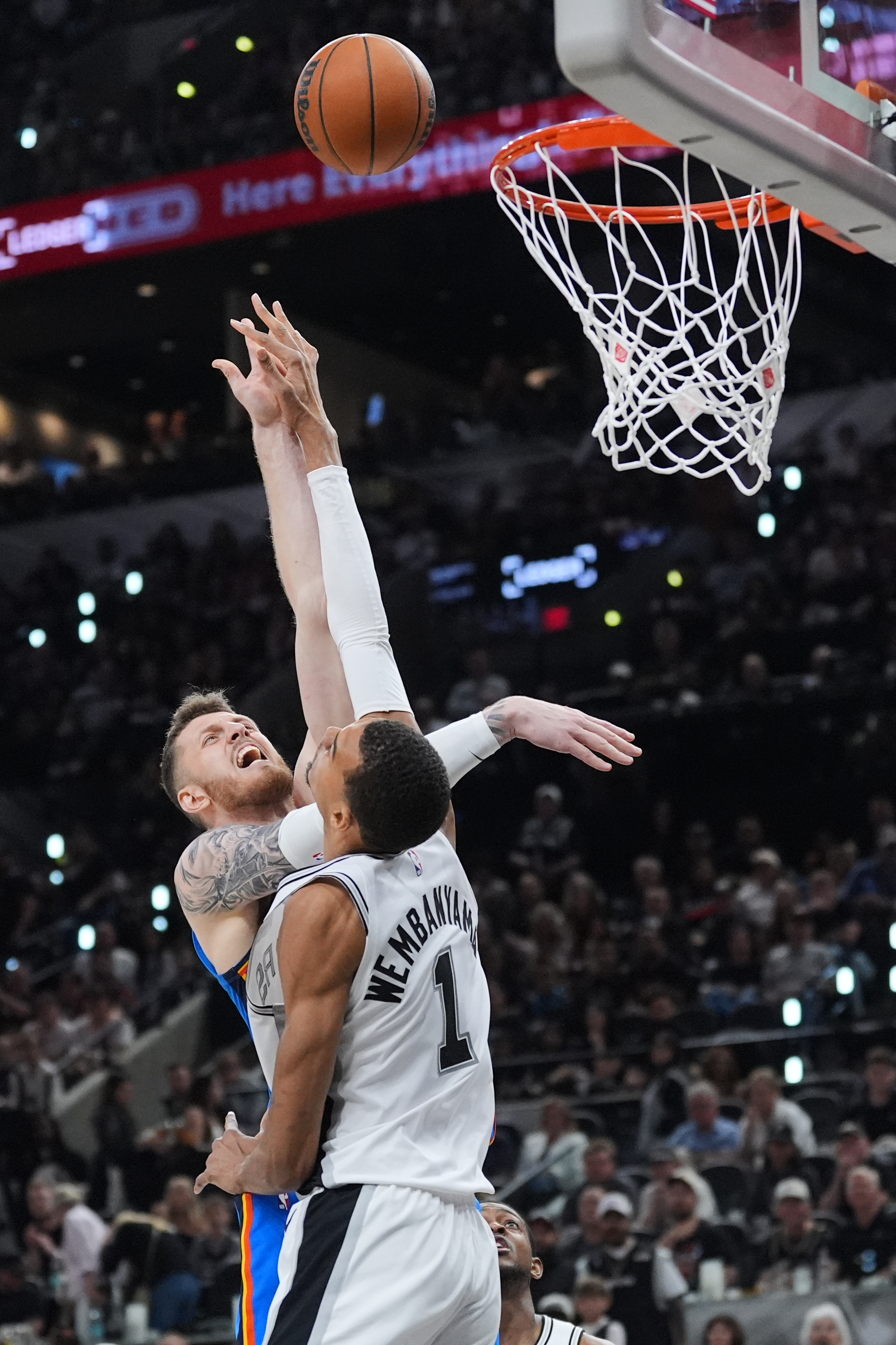 San Antonio Spurs forward Victor Wembanyama (1) blocks a shot...