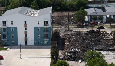 Damage is visible following an apartment complex fire, Friday, May 29, 2026, in Dallas. (AP Photo/Julio Cortez)