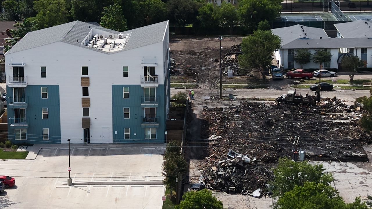Damage is visible following an apartment complex fire, Friday, May 29, 2026, in Dallas. (AP Photo/Julio Cortez)
