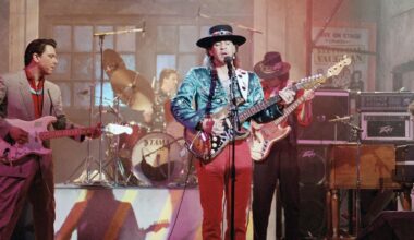 Guitarist Stevie Ray Vaughan, of Austin, Texas, center, rehearses with his band Double Trouble for a performance on Saturday Night Live, Feb. 13, 1986, New York. Bassist Tommy Shannon is at right. Guitarist Jimmie Vaughan is at left. (AP Photo/Marty Lederhandler)