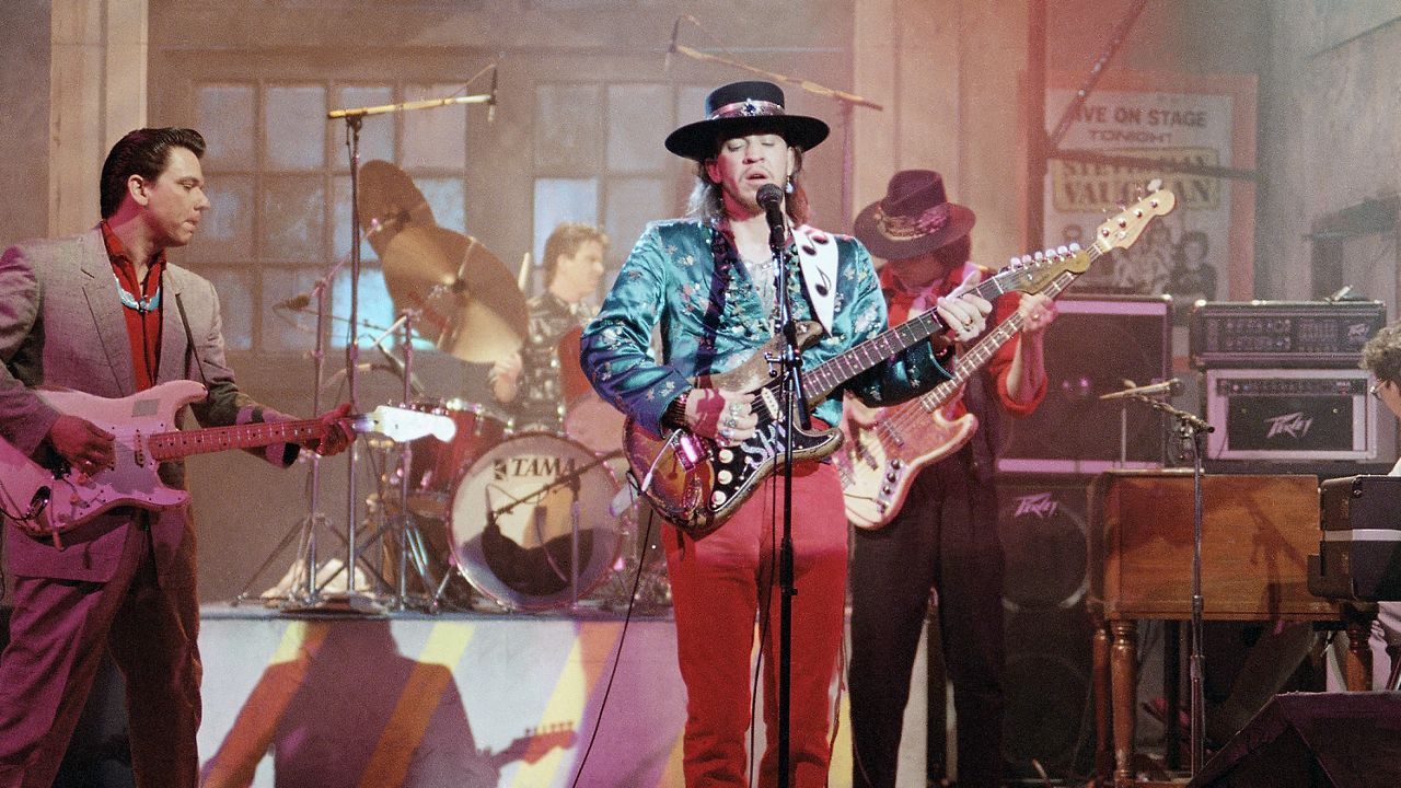 Guitarist Stevie Ray Vaughan, of Austin, Texas, center, rehearses with his band Double Trouble for a performance on Saturday Night Live, Feb. 13, 1986, New York. Bassist Tommy Shannon is at right. Guitarist Jimmie Vaughan is at left. (AP Photo/Marty Lederhandler)