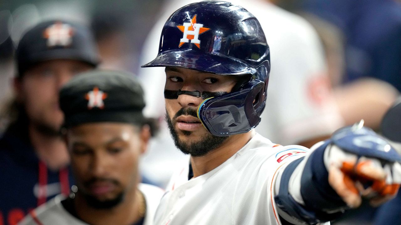 Houston Astros' Carlos Correa (1) celebrates his home run with teammates in the dugout during the sixth inning of a baseball game against the New York Yankees, Saturday, April 25, 2026, in Houston. (AP Photo/Karen Warren)