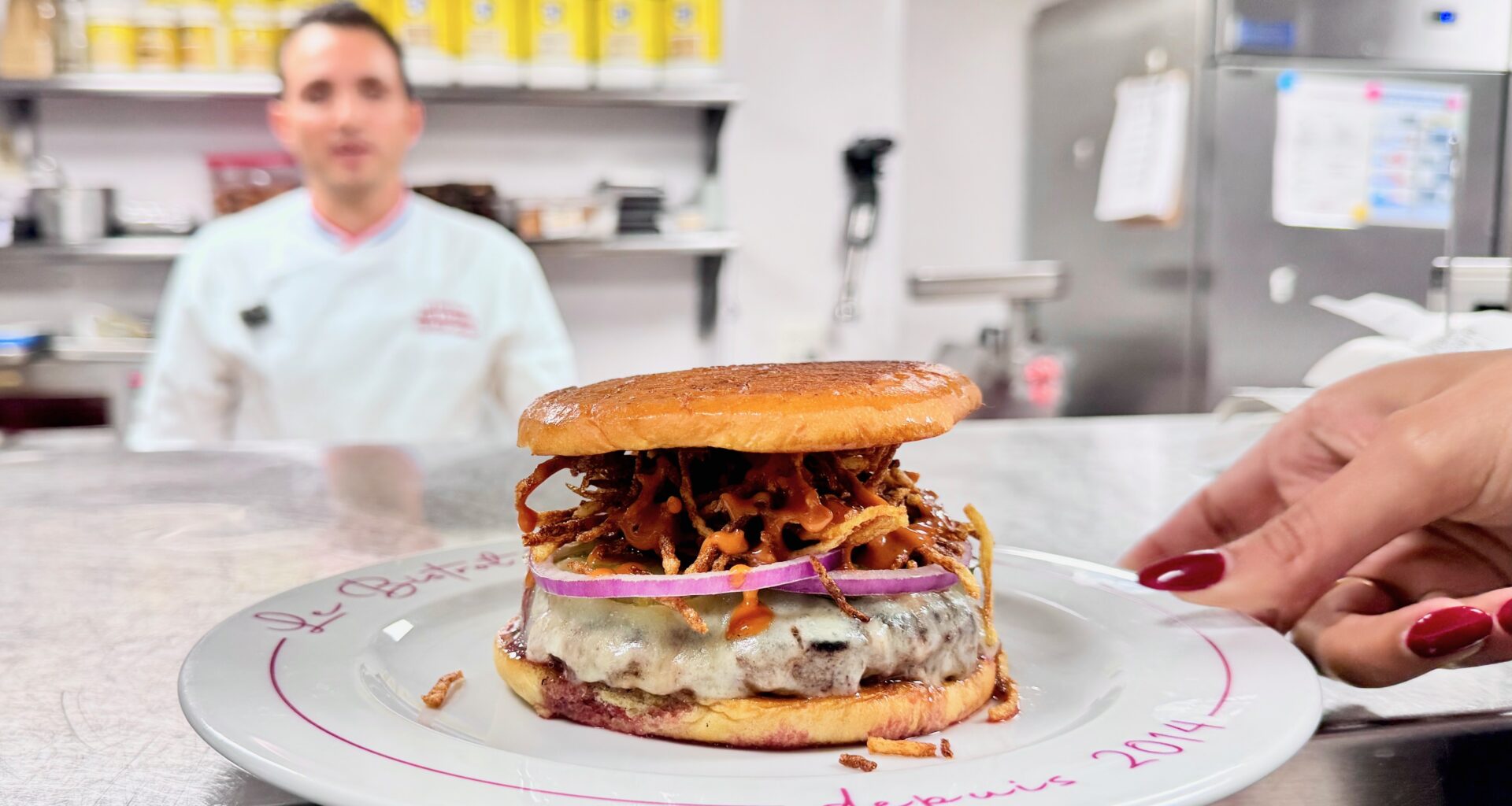 chef Eliott Azoulay at Bar Sardine cooking a burger