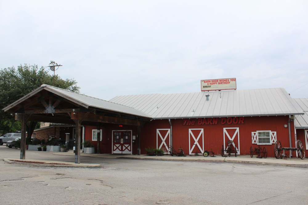 The red exterior of the Barn Door restaurant, which was open for reservations on May 7, 2026. The restaurant will close on May 10.