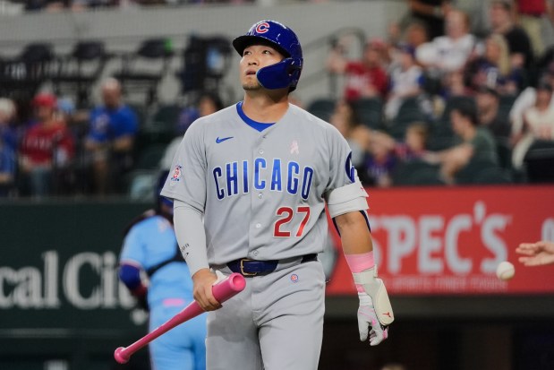 The Cubs' Seiya Suzuki walks away from the batter's box after striking out against Rangers starter Jacob deGrom in the first inning Sunday, May 10, 2026, in Arlington, Texas. (AP Photo/Tony Gutierrez)
