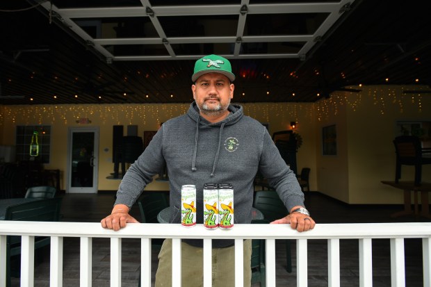 Owner Cody Kyttle poses for a photograph with his canned margarita on the patio of CK's Cantina & Grill in Dallas Thursday, May 21, 2026. (SEAN MCKEAG / STAFF PHOTOGRAPHER)