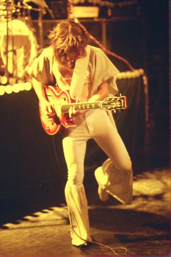 Rik Emmett flies into a guitar solo during one of the band's vintage performances.