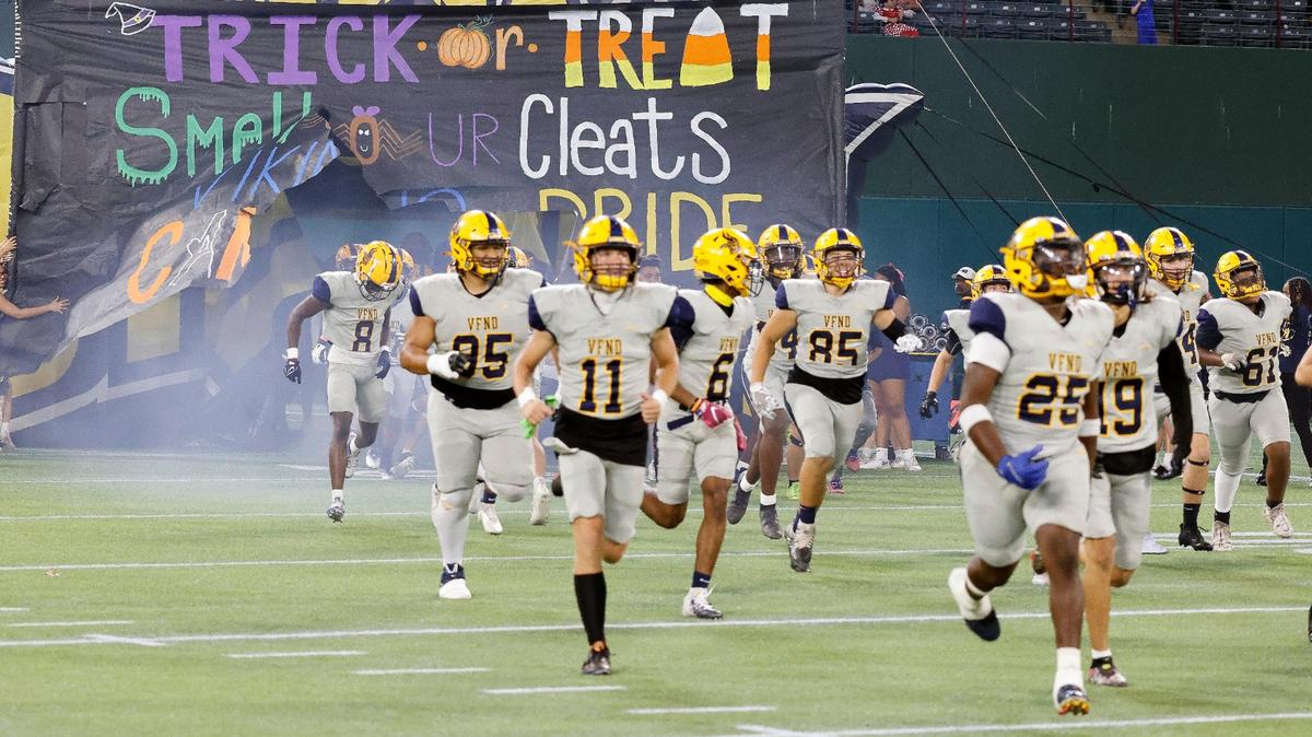 The Arlington Lamar Vikings enter the field for the first half of a UIL high school football game on Thursday, October 26, 2023 at Choctaw Stadium in Arlington, Texas. The Arlington Lamar Vikings enter the field for the first half of a UIL high school football game on Thursday, October 26, 2023 at Choctaw Stadium in Arlington, Texas.