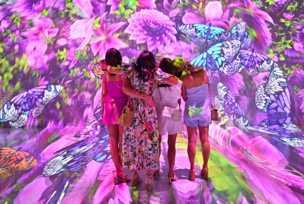 Image shows a group of people at ARTECHOUSE.