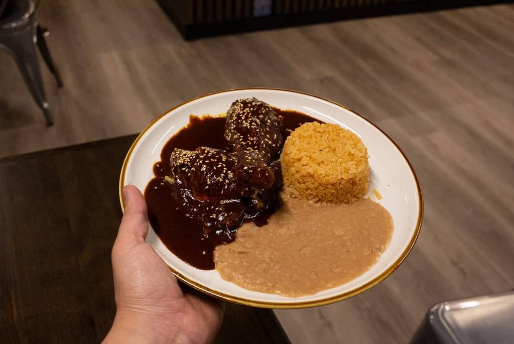 Image shows a mole plate as served at Alturas Mexican Cafe in Houston. 