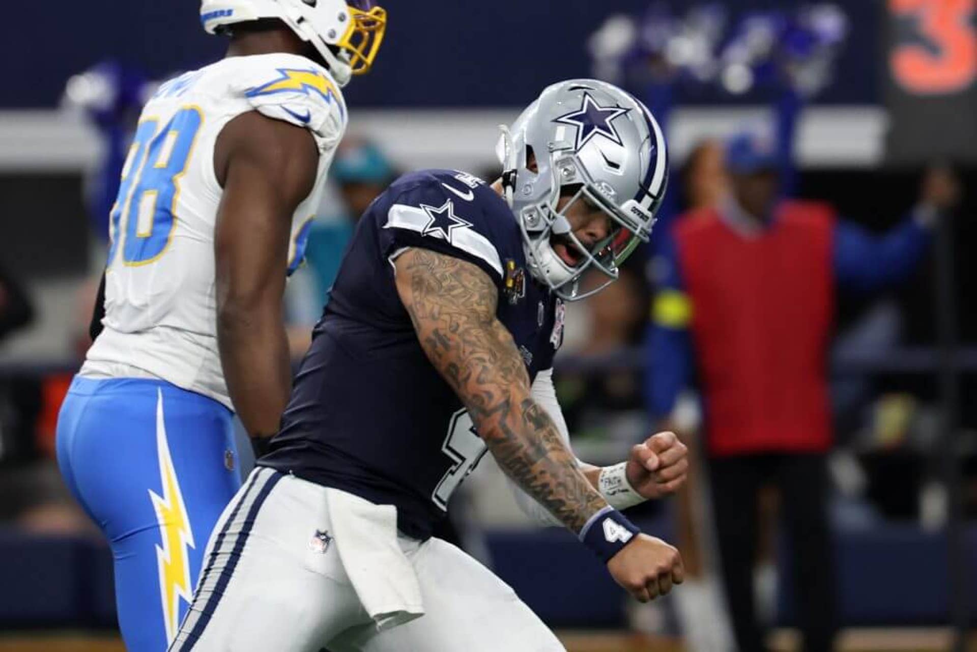 Dak Prescott #4 of the Dallas Cowboys celebrates after a touchdown in the first quarter of the game against the Los Angeles Chargers at AT&T Stadium on December 21, 2025 in Arlington, Texas.