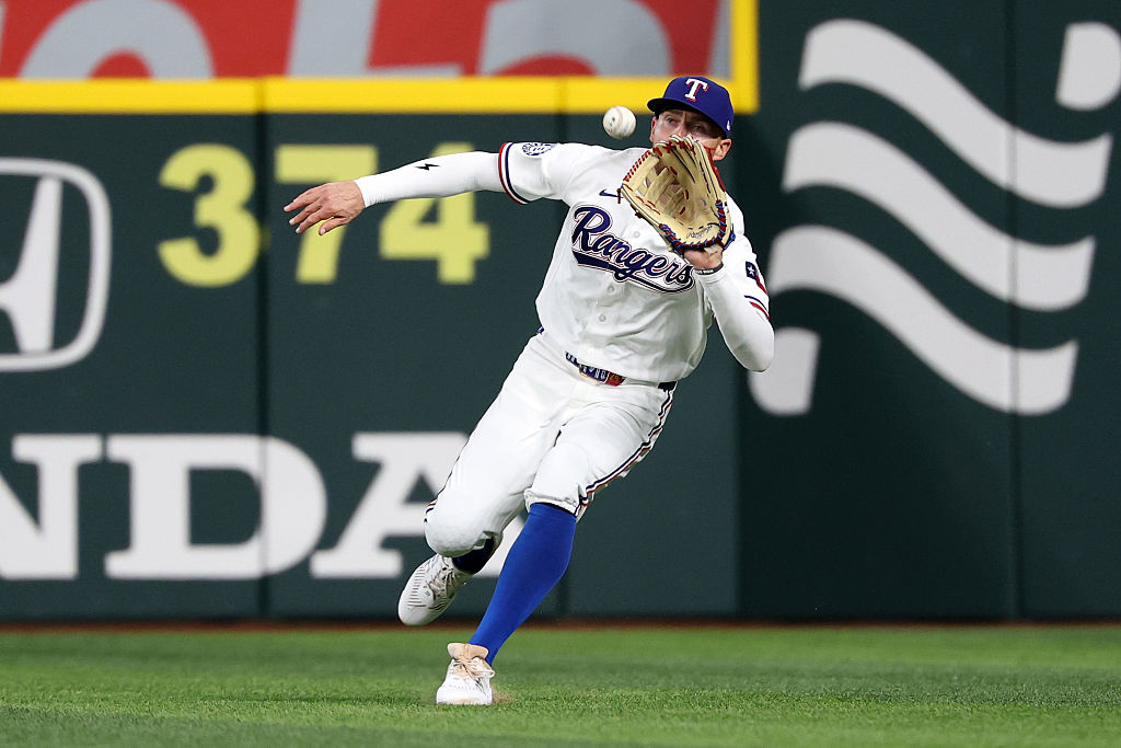 ARLINGTON, TEXAS - APRIL 29: Brandon Nimmo #24 of the Texas Rangers fields a fly ball during the third inning against the New York Yankees at Globe Life Field on April 29, 2026 in Arlington, Texas. (Photo by Stacy Revere/Getty Images)