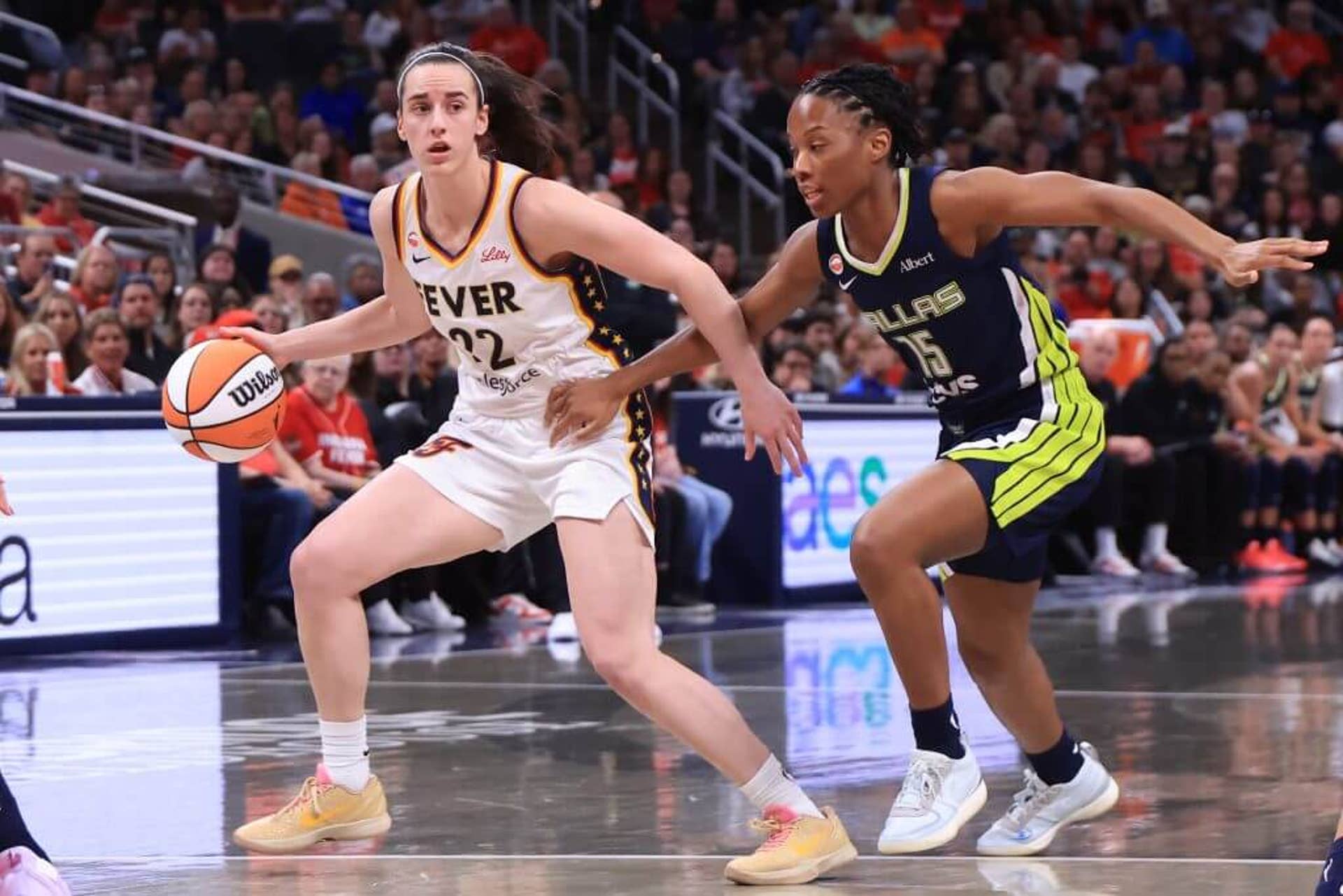 Indiana Fever guard Caitlin Clark brings the ball up court during a preseason game Thursday against the Dallas Wings.