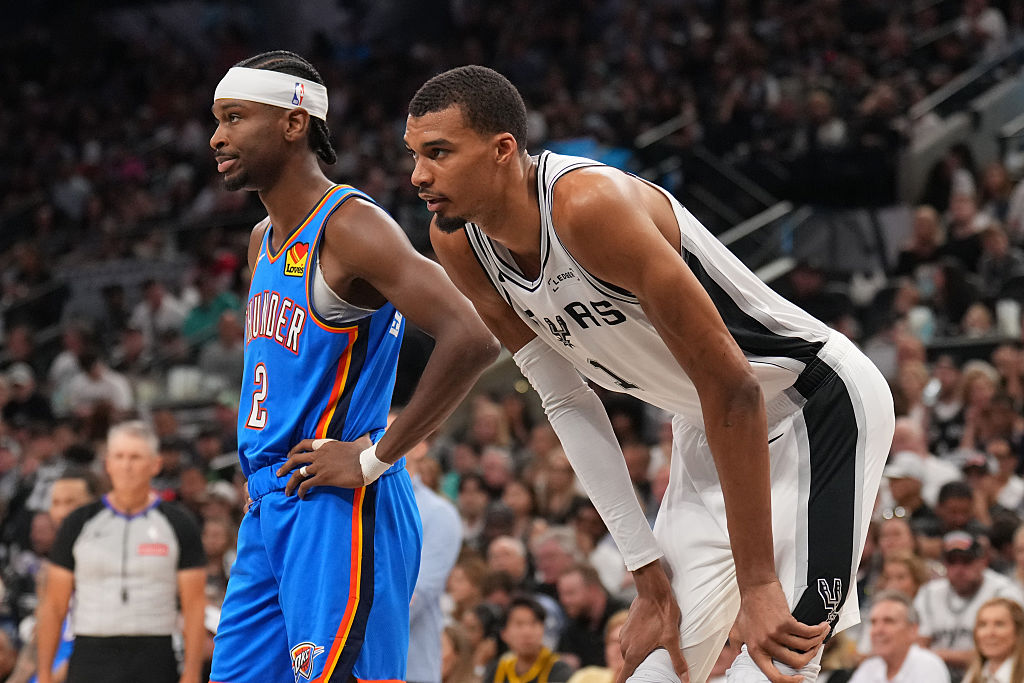 OKLAHOMA CITY, OK - MAY 24: Shai Gilgeous-Alexander #2 of the Oklahoma City Thunder and Victor Wembanyama #1 of the San Antonio Spurs look on during Game Four of the NBA Western Conference Finals on May 24, 2026 at Paycom Center in Oklahoma City, Oklahoma. NOTE TO USER: User expressly acknowledges and agrees that, by downloading and or using this photograph, User is consenting to the terms and conditions of the Getty Images License Agreement. Mandatory Copyright Notice: Copyright 2026 NBAE (Photo by Jesse D. Garrabrant/NBAE via Getty Images)