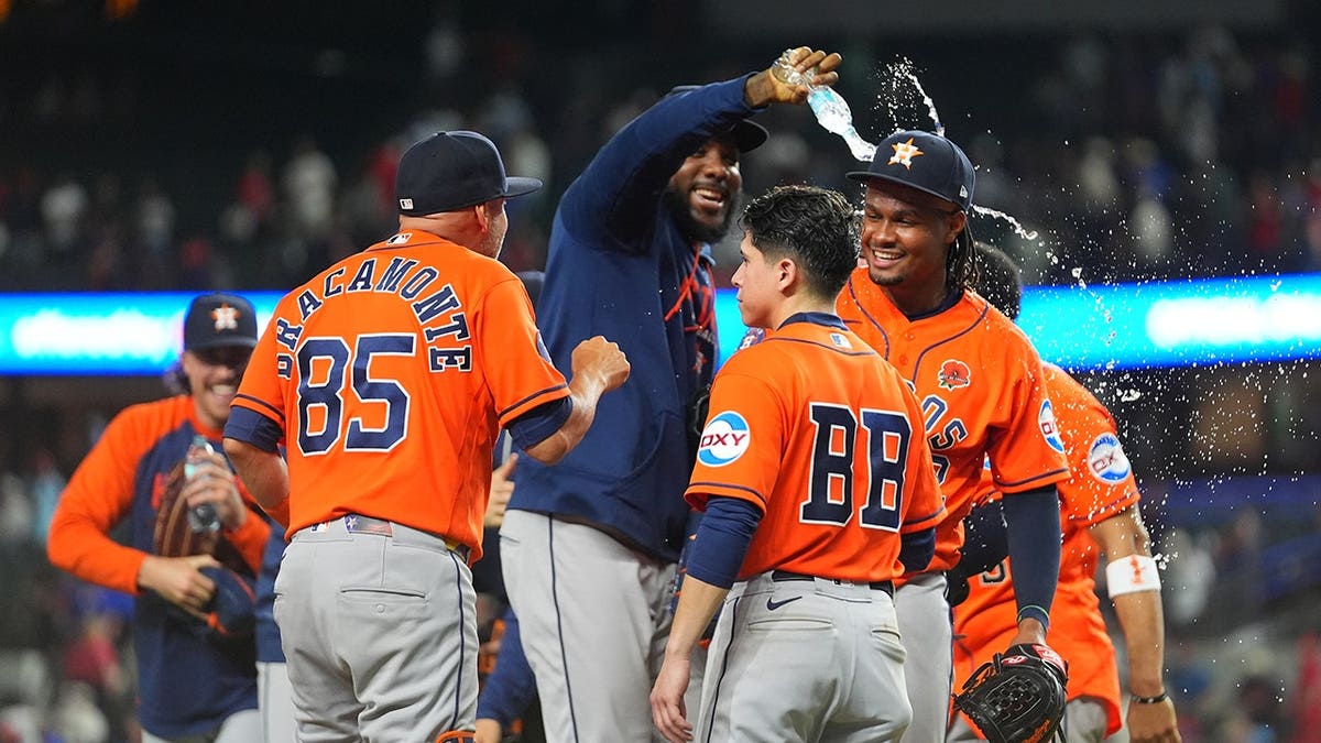 Alimber Santa being doused with water after pitching in major league debut