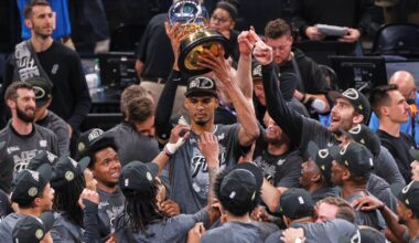 Spurs superstar Victor Wembanyama holds the Oscar Robertson Trophy aloft after San Antonio shocked the Thunder in Game 7 Saturday night in Oklahoma City.