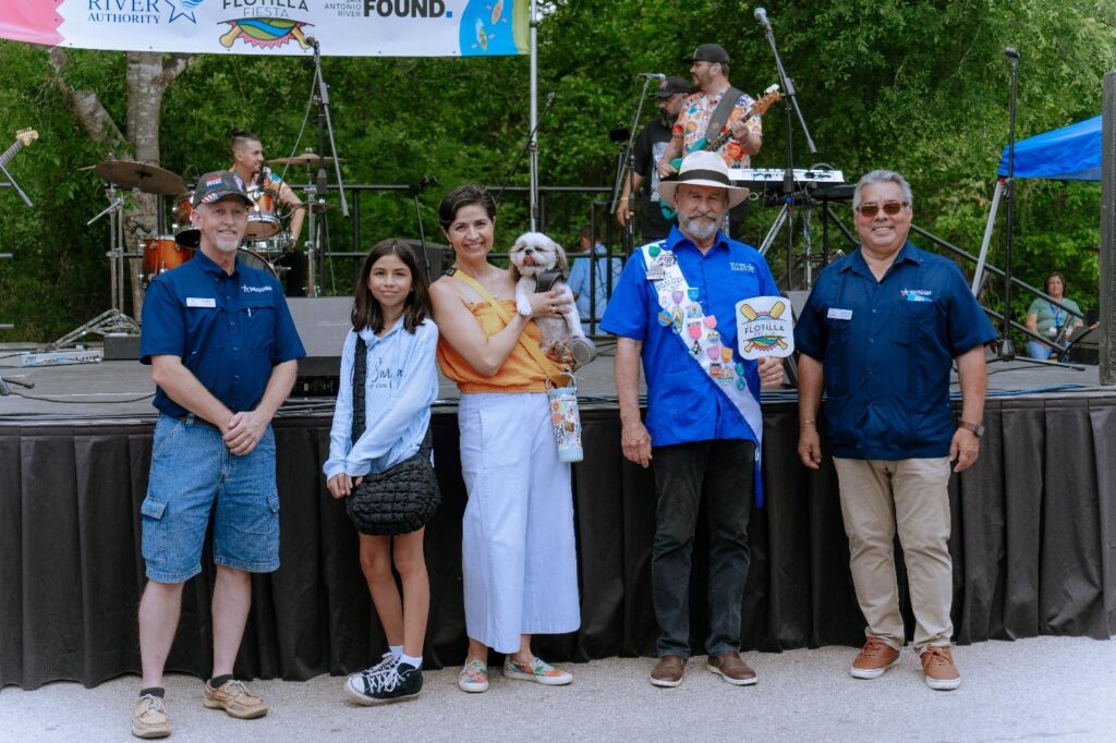 Caption: Jim Campbell with members of the River Authority Board at the River Authority’s 2025 Fiesta Flotilla.