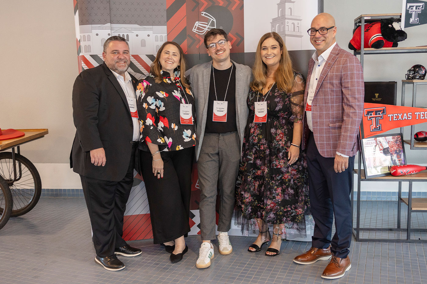 Five representatives from Liberty Education and Texas Tech pose at an event in Brazil