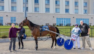 Luke Plano was presented with a Congratulatory banner in the Winner's Circle for his $20 million milestone