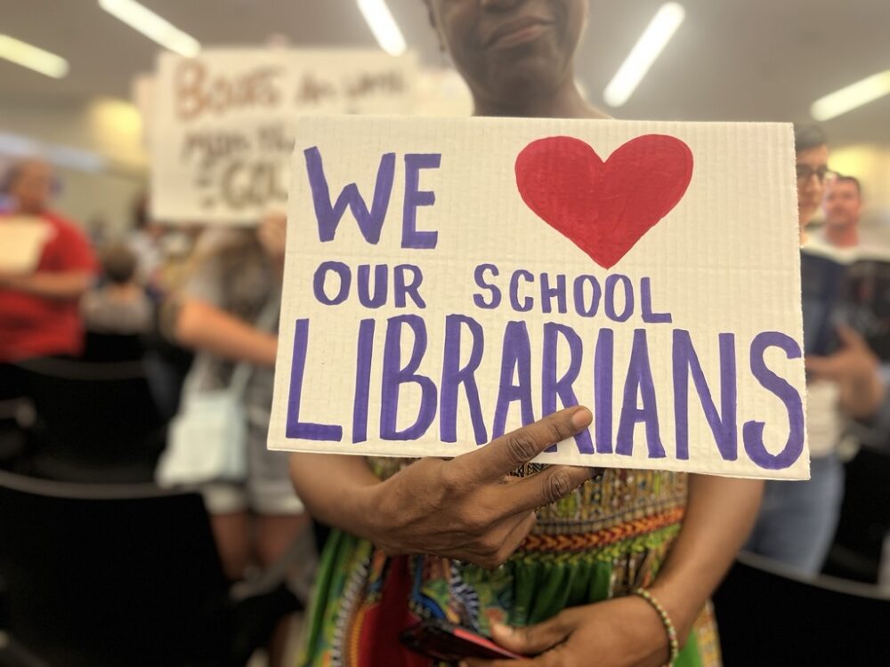 A protest of people reading books outside its Board of Managers meeting.