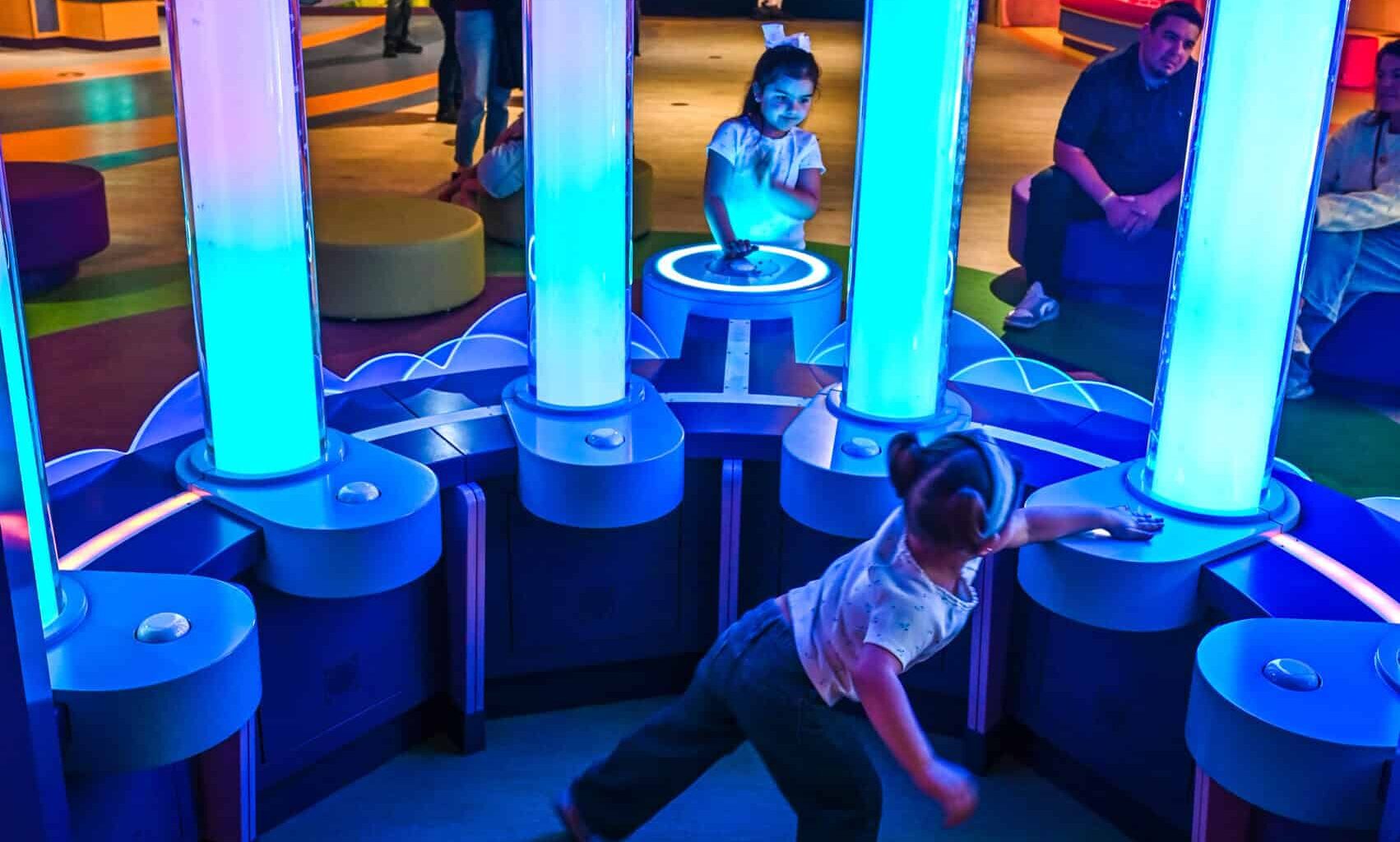 Interactive neon-lit play zone for children at DFWChild event.