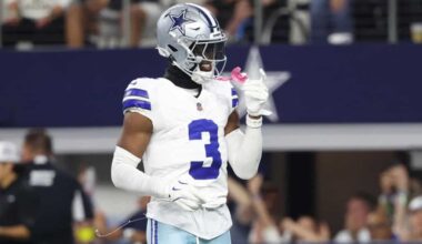 George Pickens reacting on the field in a Cowboys uniform, with ongoing speculation surrounding his decision not to sign the franchise tag.