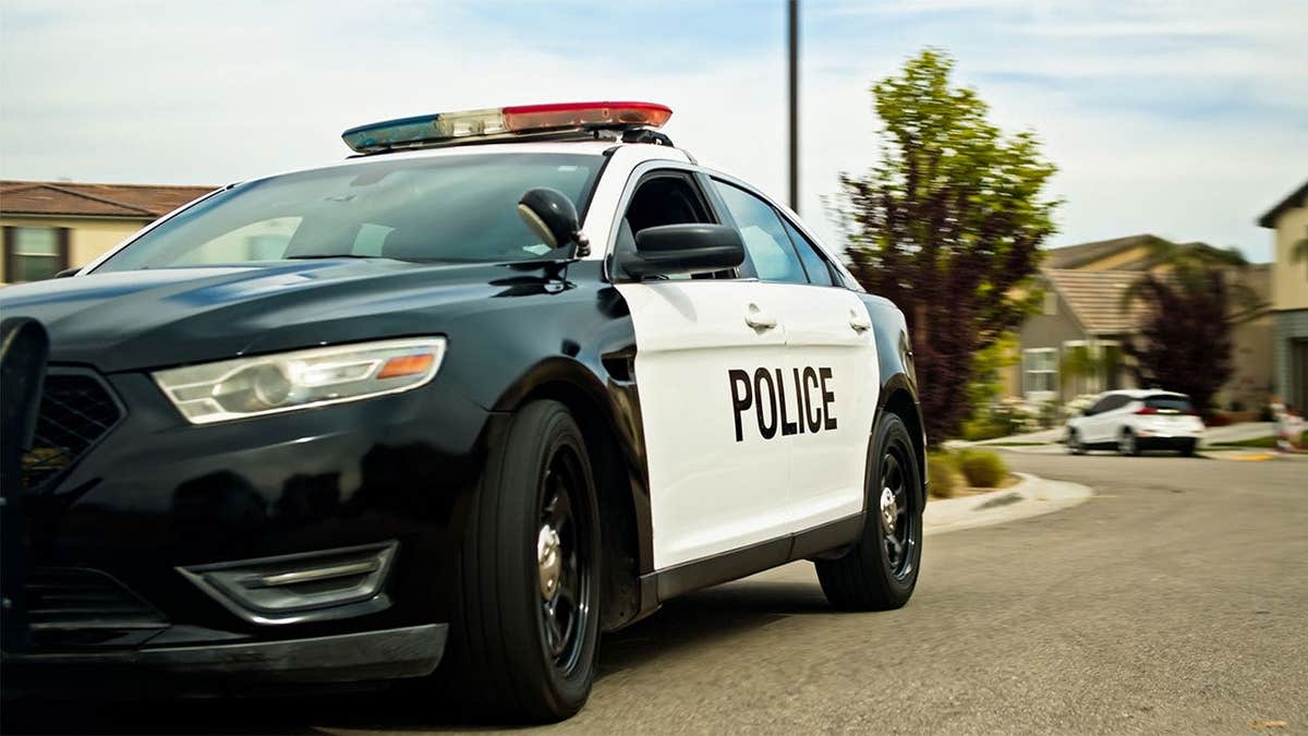 Police car in a suburban neighborhood
