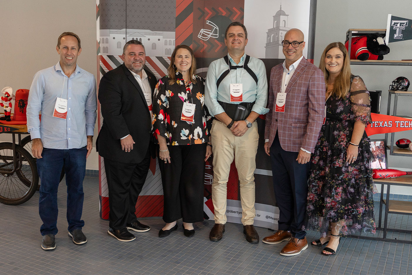 Six representatives from Texas Tech and Liberty Education standing together at an event in Brazil.