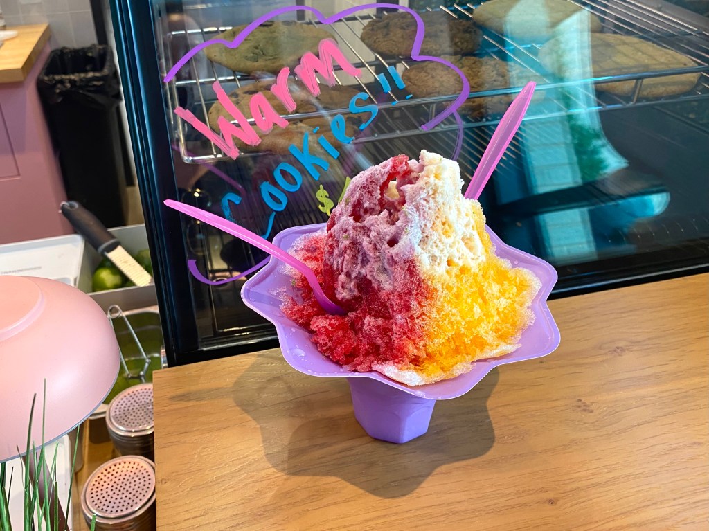 a colorful sno cone in a purple bowl