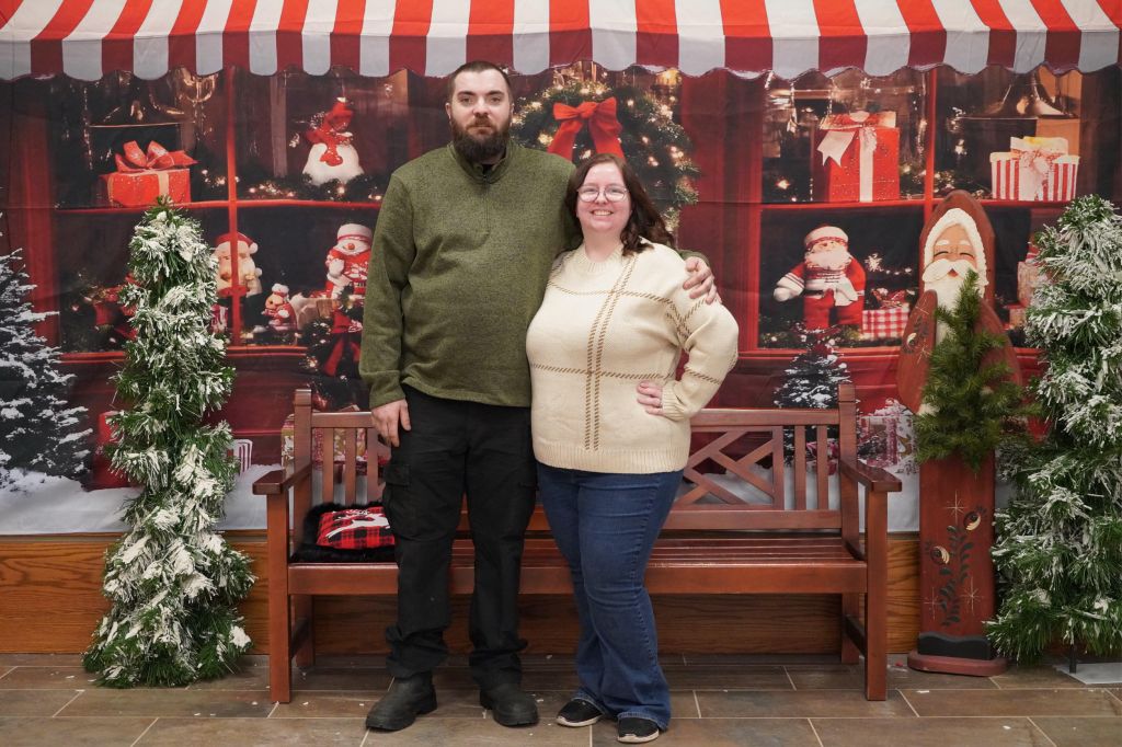 Keaslie Hall with her husband outside of a holiday display.