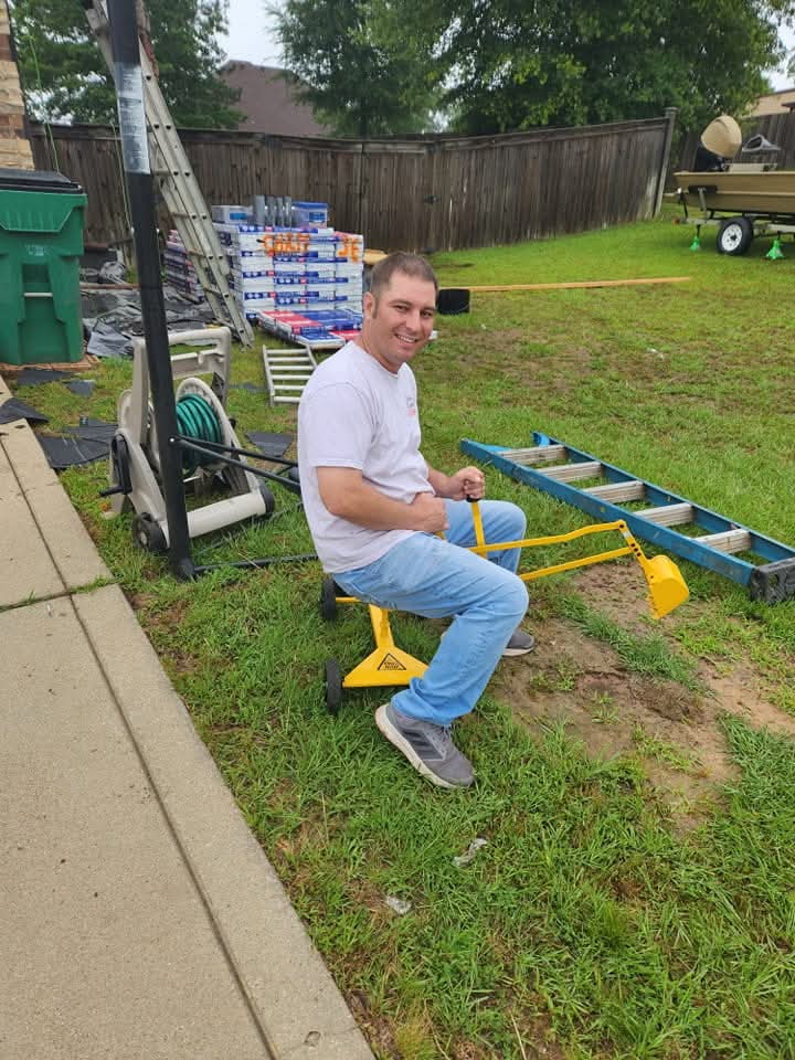 Chris Langford on a children's excavator.