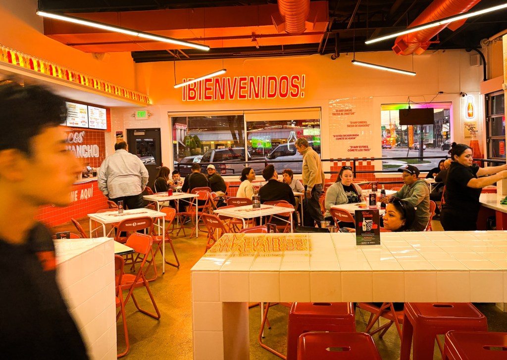 the interior of tacos juanchos, which is very orange and pink.