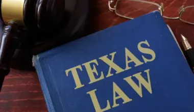 Blue book with gold text reading "Texas law" next to gavel and glasses on wood surface; An Overview of Shaw v. Simpson in Corpus Christi, Texas