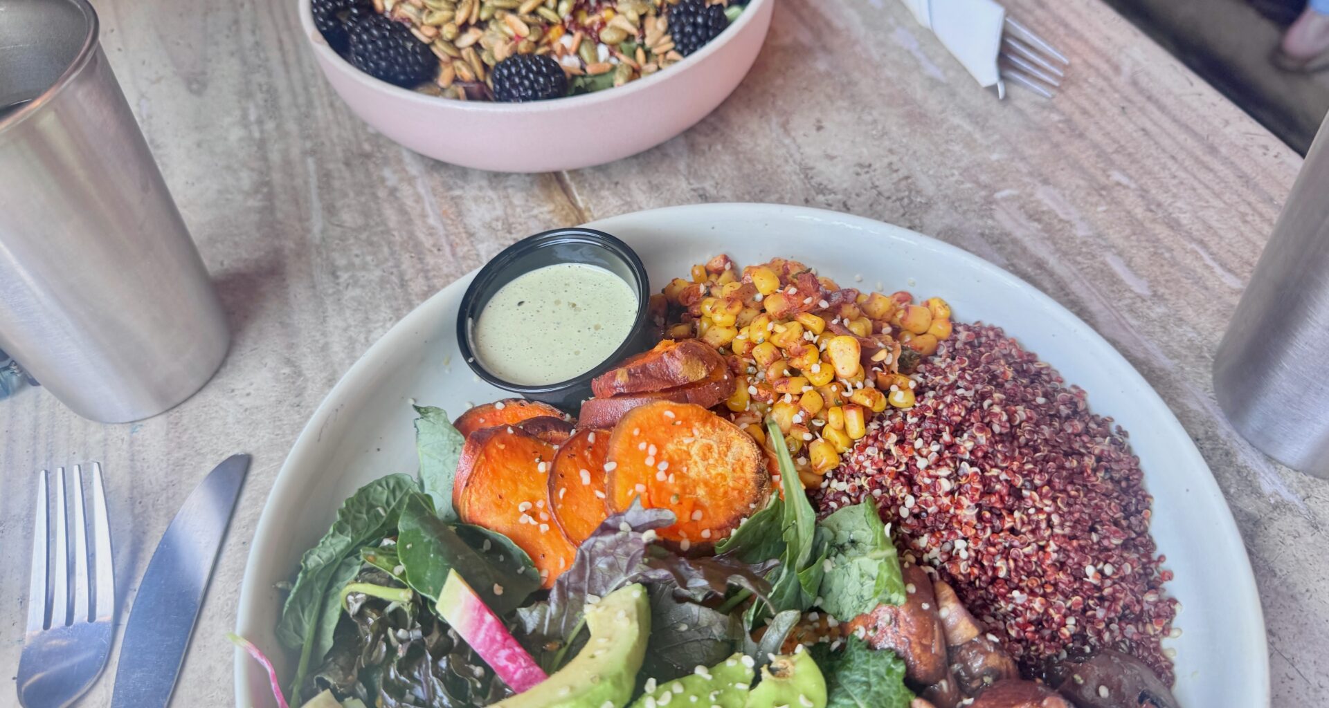 two salads on a table at Tribal All Day Cafe