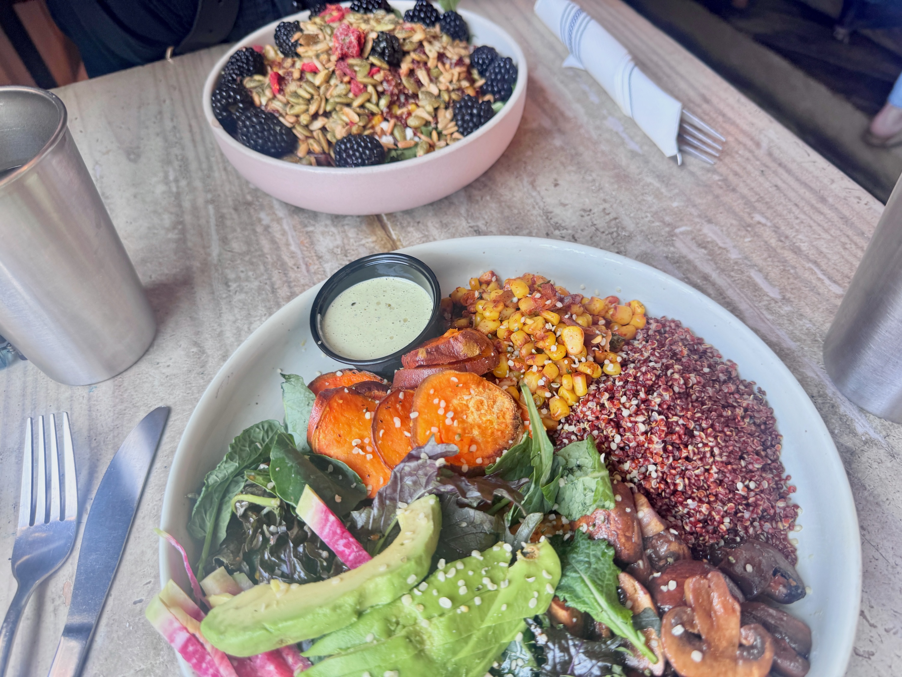 two salads on a table at Tribal All Day Cafe