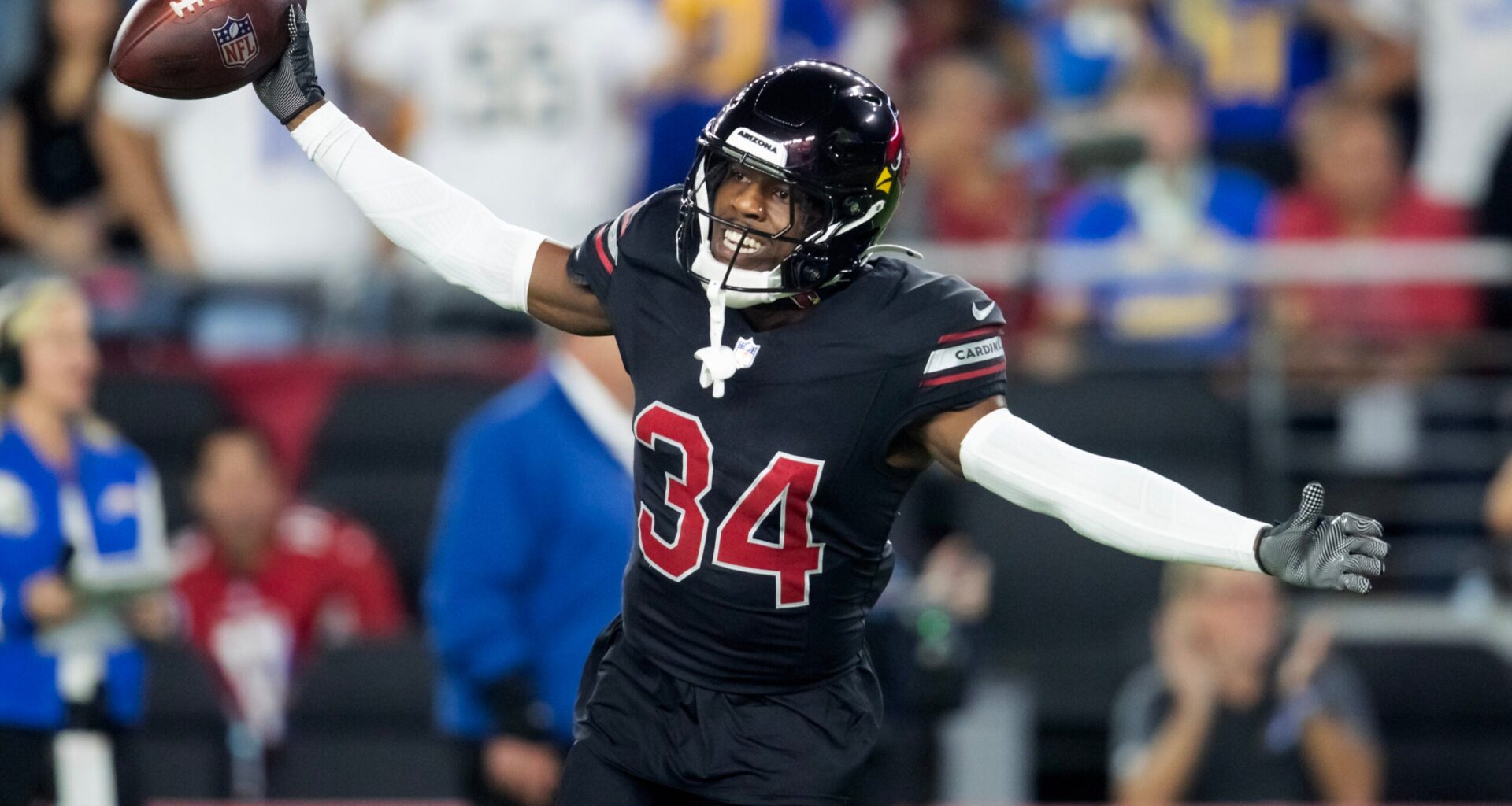 Oct 21, 2024; Glendale, Arizona, USA; Arizona Cardinals safety Jalen Thompson (34) celebrates after recovering a fumble from the Los Angeles Chargers in the first half at State Farm Stadium.