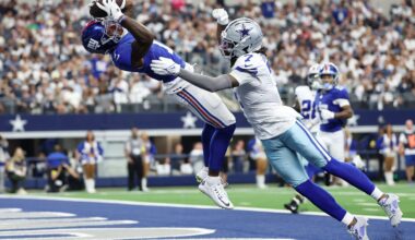 Sep 14, 2025; Arlington, Texas, USA; New York Giants wide receiver Malik Nabers (1) makes a catch for a touchdown against Dallas Cowboys cornerback Trevon Diggs (7) during the second quarter at AT&T Stadium.