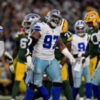Sep 28, 2025; Arlington, Texas, USA; Dallas Cowboys defensive tackle Osa Odighizuwa (97) celebrates during the game between the Dallas Cowboys and the Green Bay Packers at AT&T Stadium.