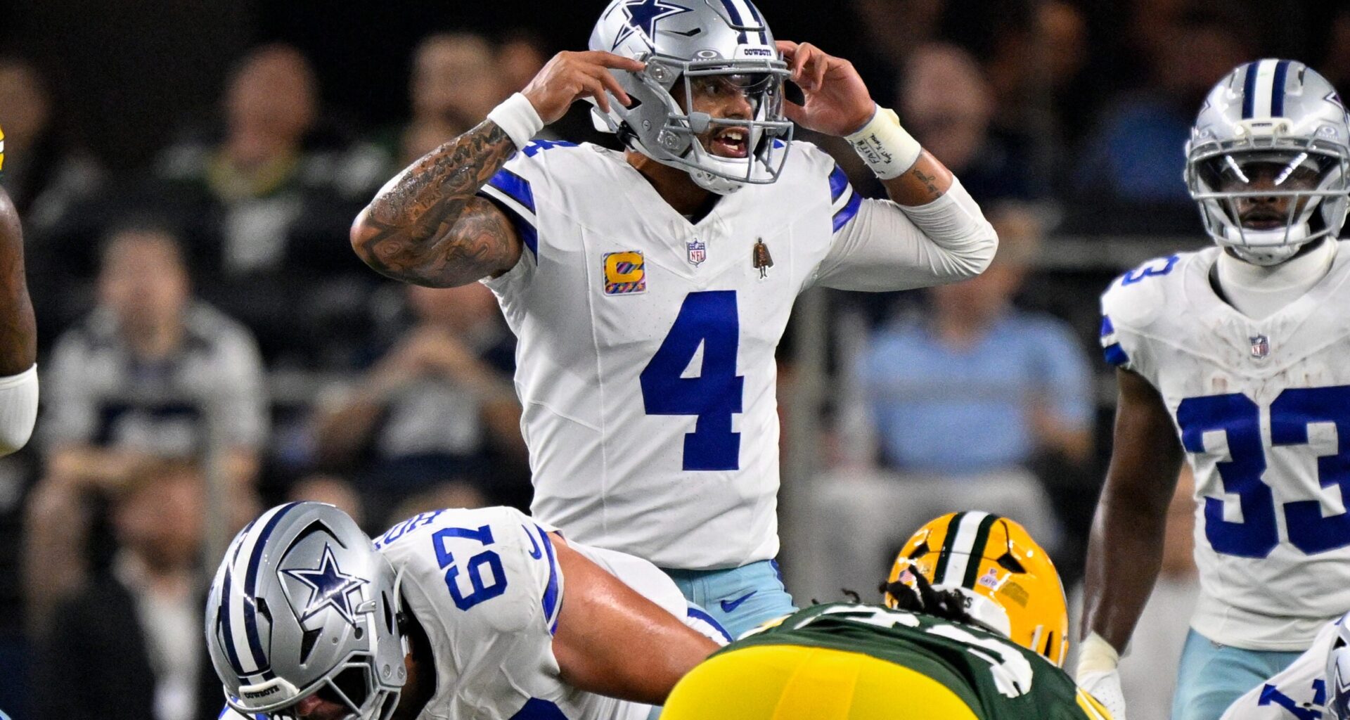 Sep 28, 2025; Arlington, Texas, USA; Dallas Cowboys quarterback Dak Prescott (4) motions to his team during the game between the Dallas Cowboys and the Green Bay Packers at AT&T Stadium.