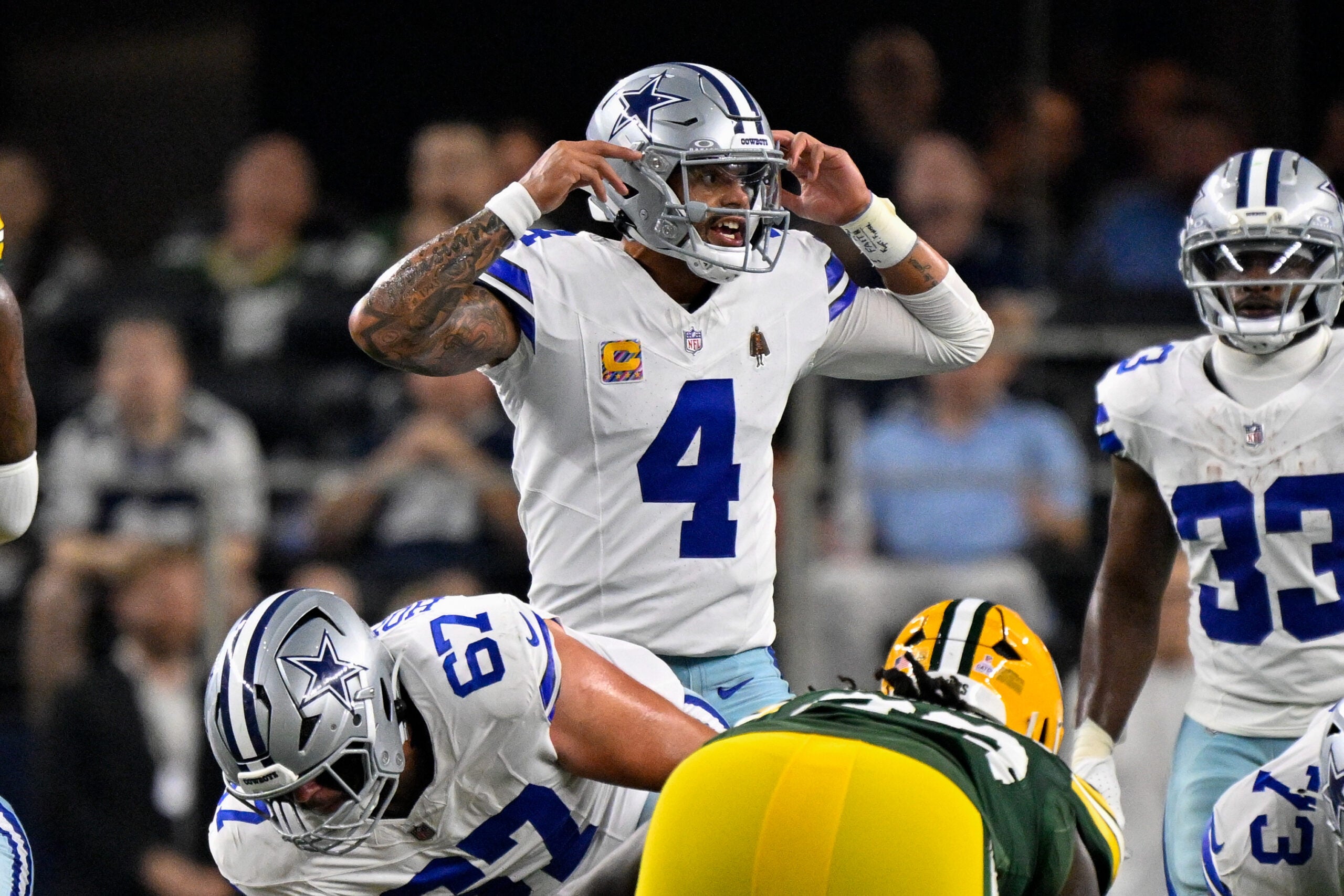 Sep 28, 2025; Arlington, Texas, USA; Dallas Cowboys quarterback Dak Prescott (4) motions to his team during the game between the Dallas Cowboys and the Green Bay Packers at AT&T Stadium.
