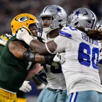 Sep 28, 2025; Arlington, Texas, USA; Dallas Cowboys offensive tackle Tyler Guyton (60) blocks Green Bay Packers defensive end Micah Parsons (1) during the game between the Dallas Cowboys and the Green Bay Packers at AT&T Stadium.